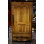 French Provincial linen press, circa 1830, having a molded cornice with canted corners, the case