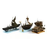 (lot of 3) Folk Art model boat group, 20th century, depicting Prehistoric crafts, including a