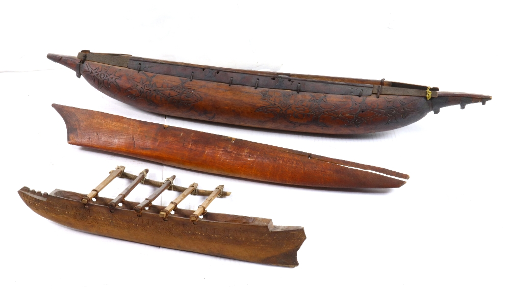 (lot of 3) Model of carved wood outrigger and canoe, 36"h. Provenance: Property from the Spenger's