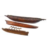 (lot of 3) Model of carved wood outrigger and canoe, 36"h. Provenance: Property from the Spenger's