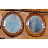 Pair of Victorian walnut looking glasses, each having an oval frame, 15"h x 13.5"w