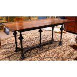 Jacobean style mahogany drop leaf trestle table, having two hinged leaves, and rising on turned legs