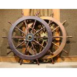 (lot of 2) Ship's wheel group, both executed in brass and turned wood, 58" dia. Provenance: Property