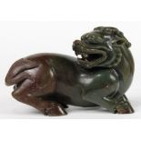 Chinese hardstone carving, the qilin with its head resting on its back, the dark green matrix