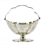 George III sterling silver swing handle sugar basket, London, 1797, by Solomon Hougham, having a