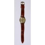 Omega 14k yellow gold wristwatch Dial: round, textured gold tone, applied baton hour markers,
