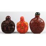 (lot of 3) Chinese cinnabar lacquered snuff bottles: one decorated with figures in landscape,