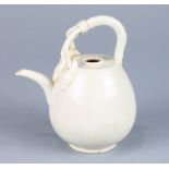 Chinese Ding-type ceramic ewer, of lobed melon form tapering toward the top, the handle splits to