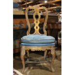 Louis XV style giltwood side chair, having a shell crest rail, rising on cabriole legs conjoined
