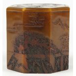 Chinese soapstone seal, of octagonal form depicting a riverside landscape in low relief, 3"h;