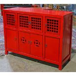 Chinese red coffer, with four lattice openwork hinged doors above four solid doors with the