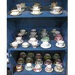 Three shelves of associated tea cups and saucers, by various makers including Aynsley, Dresden,