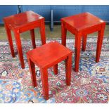 (lot of 3) Group of red side tables, of various sizes, each with a rectangular top raised on