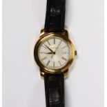 Tiffany & Co. 18k yellow gold wristwatch Dial: round, sunken concentric, center dial, raised gold