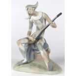 Lladro bisque sculpture, of a seated harlequin mandolin player, 10.5"h x 8"w x 6.5"d