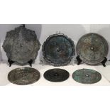 (lot of 6) Chinese alloy metal mirrors, including four of circular form decorated with mythical