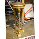 George III style giltwood pedestal having a circular top and rising on a tripartite base, having a