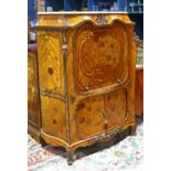 Louis XV style inlaid cabinet, having a shaped marble top above a tambour door, continuing to two