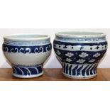 (lot of 2) Chinese blue and white porcelain jars, each of the wide shoulders tapering to a