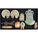 (lot of 9) Chinese archaistic hardstone carvings, consisting of a figure in a robe with scroll