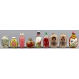 (lot of 9) Chinese glass snuff bottles: consisting two red overlay glass bottles, one with fish