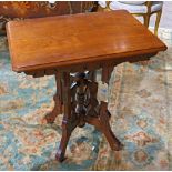 Victorian Eastlake parlor table, having a rectangular top over the carved apron, 28"h x 28"w x 20.