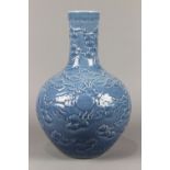 Chinese blue glazed molded porcelain vase, the cylindrical neck and a globular body overall molded