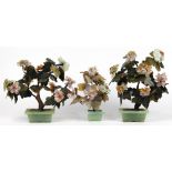 (lot of 4) Chinese stone and glass trees: a glass flowering tree in a celadon porcelain planter;