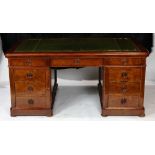 English mahogany partner's desk, mid to late 19th century, having an embossed leather top, above two