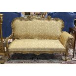 Louis XV style giltwood settee, having an ornately carved crestrail featuring leaf, scroll and