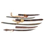 (lot of 3) Ethnographic Phalwe edged weapon group, Mid-Century, two having brass mounts the third