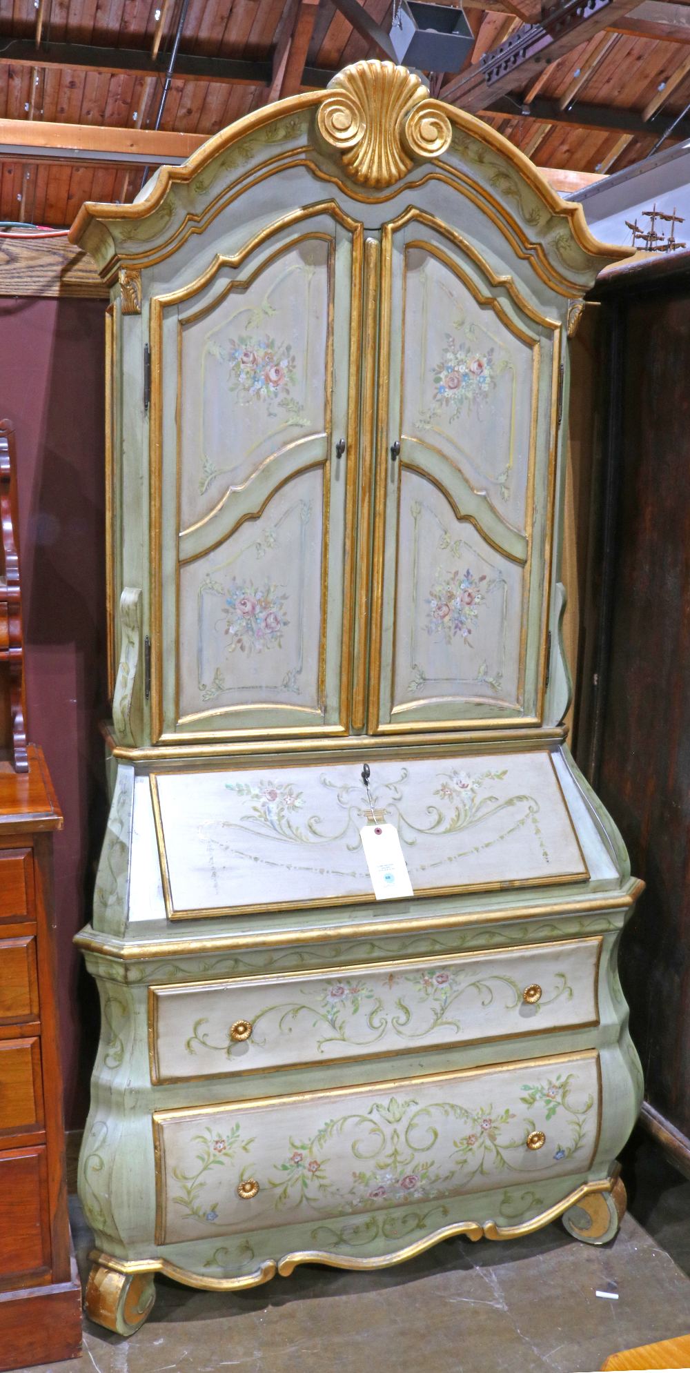 Louis XV style partial gilt bombe secretary, the polychrome decorated case with floral reserves,
