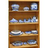 Three shelves of Mottahedeh and other porcelain table articles, primarily consisting of items from