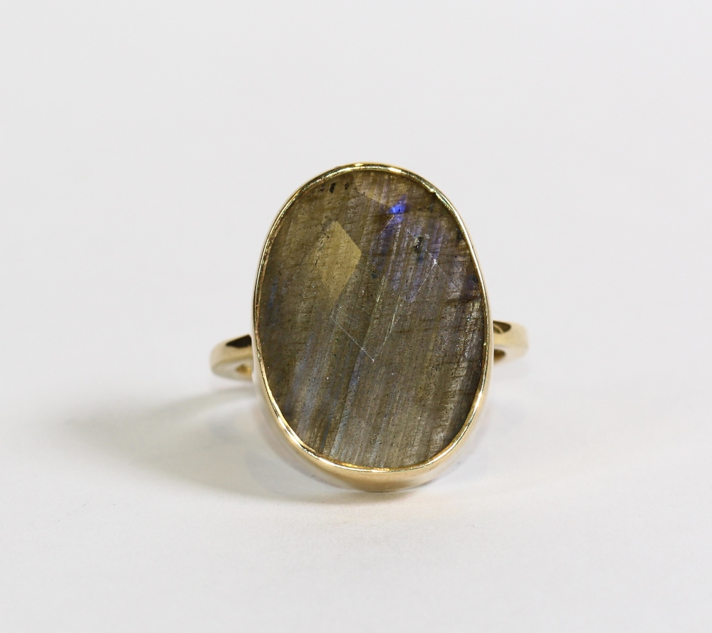 Labradorite and sterling silver gilt ring Featuring (1) oval faceted top cabochon, measuring