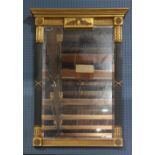 French Neoclassical style mirror, having a partial ebonized and gilt frame