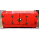 Chinese-style red wood coffer , fronted by a pair of hinged double doors, with round lock plates,