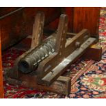 Naval Co. F-B line throwing cannon, barrel is cast bronze with a 2.5" bore, resting on a wood