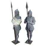 Pair of Victorian cast iron sculptures, depicting guards, each standing at attention and bearing a