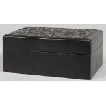 Chinese hardwood rectangular box, the lid centered with a blossom surrounded by stylized scrolls,