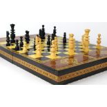 Middle Eastern style traveling chess set, having polychrome geometric banded inlay to exterior and
