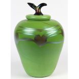 Iridescent art glass lidded sculptural jar depicting an apple, having a green body with heart shaped