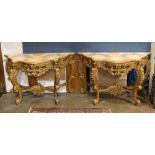 (lot of 2) Louis XV style console tables, each having a faux marble shaped top, above a giltwood