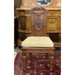 Renaissance Revival hall chair, the scroll and leaf crest surmounting the carved back, rising on