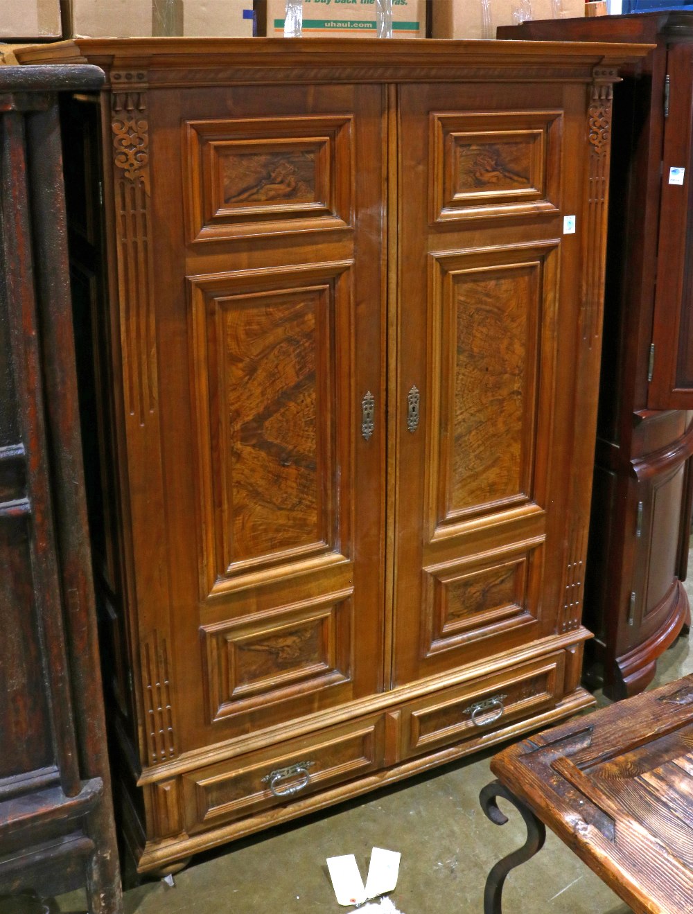 Victorian linen press, executed in walnut with walnut burl panels, and rising on compressed bun