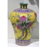 Chinese porcelain meiping form vase, featuring peach branches in a yellow scraffito ground, the