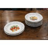 (lot of 12) German porcelain fruit dishes, having a gilt rim and a reticulated border framing the