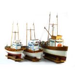 (lot of 3) Model boat group by Herman "Junky" Turkman , consisting of three fishing boats, each