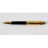 Must de Cartier Panthere roller ball pen, having a yellow gold plated body accented with black