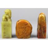 (lot of 3) Chinese soapstone seals: first, of honey hue pebble carved with scholars in landscape;