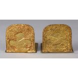 Pair of Tiffany Furnaces dore bronze bookends, having an intricately detailed landscape design,